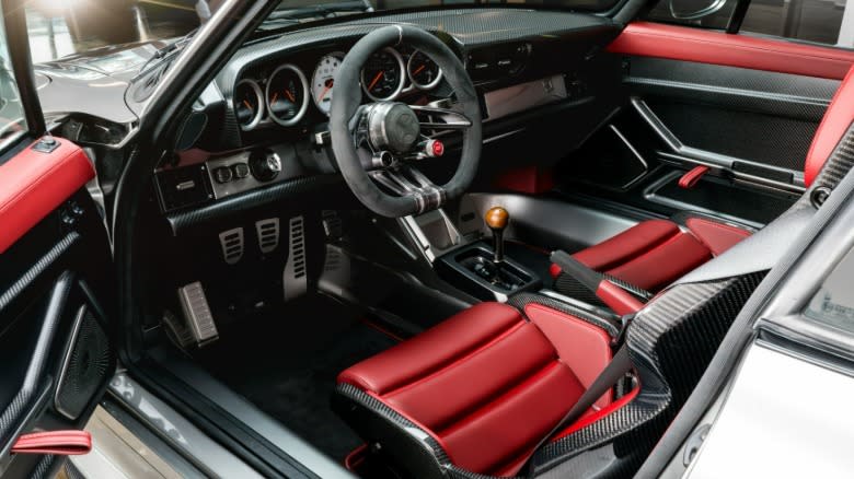 a look inside the F-26 with its red seats and lots of exposed carbon fiber