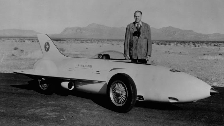 Harley Earl with a Pontiac XP-21 concept car at the Arizona test track in 1964