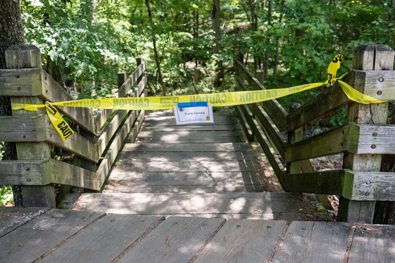 The trail head to the Devil's Den trail at Devil's Den State Park remains closed Monday, July 28, 2025, in West Fork, Ark. / Credit: Michael Woods / AP