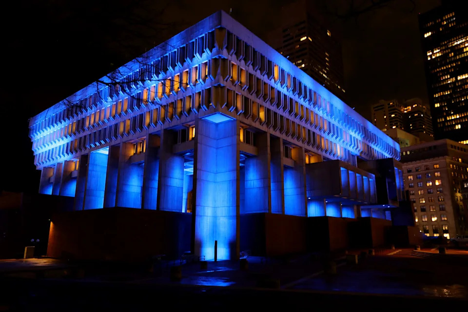 BOSTON, MASSACHUSETTS - APRIL 09: Boston City Hall is lit in blue on April 09, 2020 in Boston, Massachusetts. Landmarks and buildings across the nation are displaying blue lights to show support for health care workers and first responders on the front lines of the coronavirus (COVID-19) pandemic.