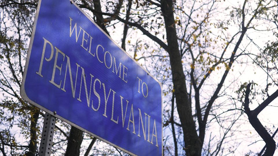 Welcome to Pennsylvania state line road signGetty