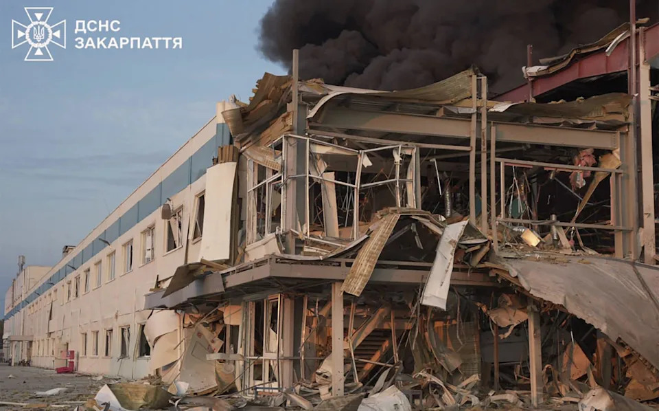 Smoke rising above a damaged building following a Russian air attack in Mukachevo, Zakarpattia region