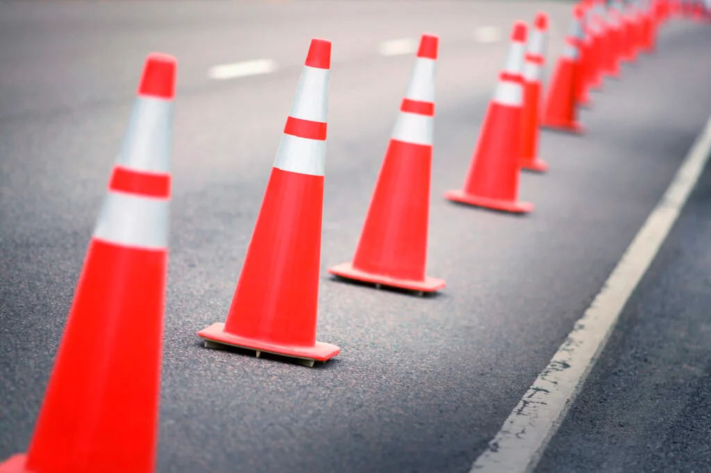 A row of traffic cones on the road.