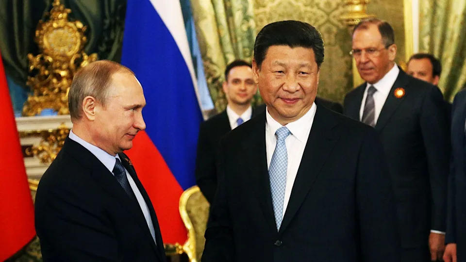 Lavrov watches Putin and Xi