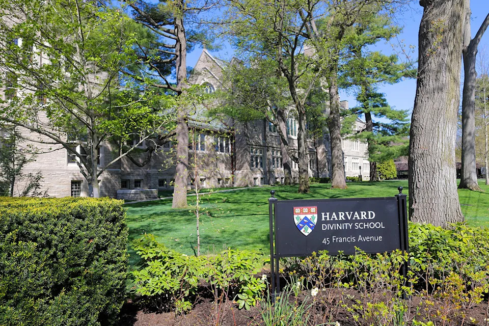 The Harvard Divinity School building exterior with the sign out front (Lane Turner / The Boston Globe via Getty Images file)