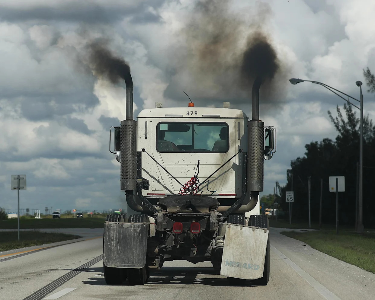 <span>Exhaust pipes on a truck in Miami in this 2019 picture. </span><span>Photograph: Joe Raedle/Getty Images</span>