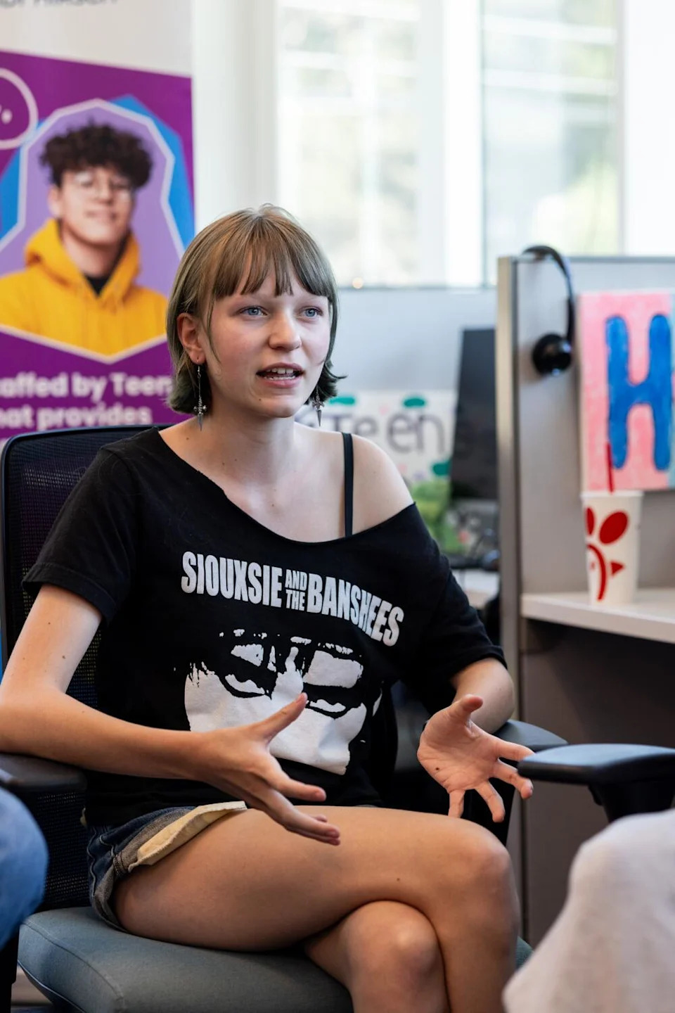 Teen Line volunteer Max, 15, speaks to the Times during an interview