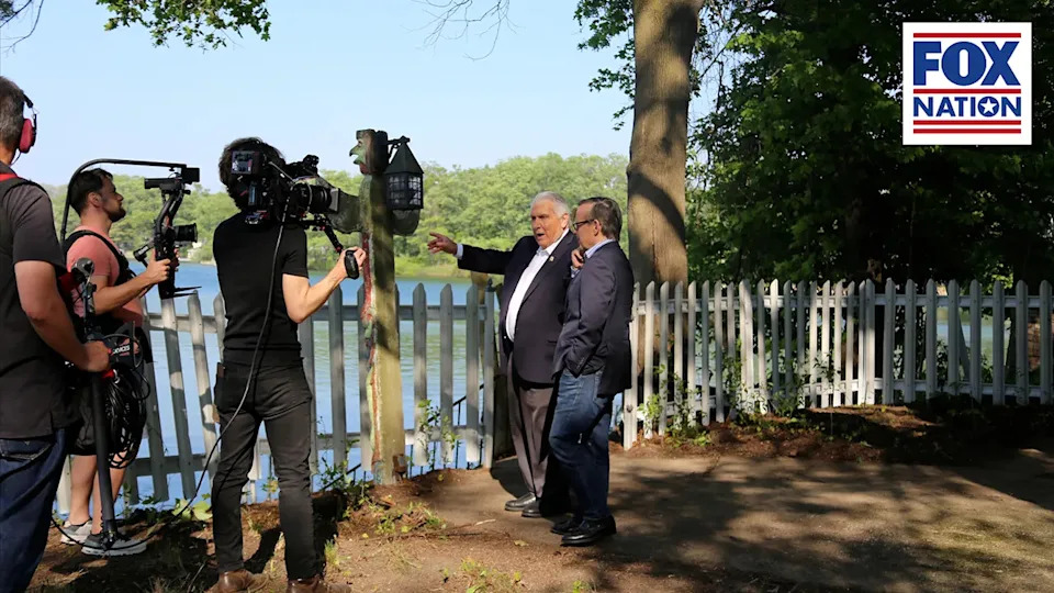 James P. Hoffa and Eric Shawn by the lake