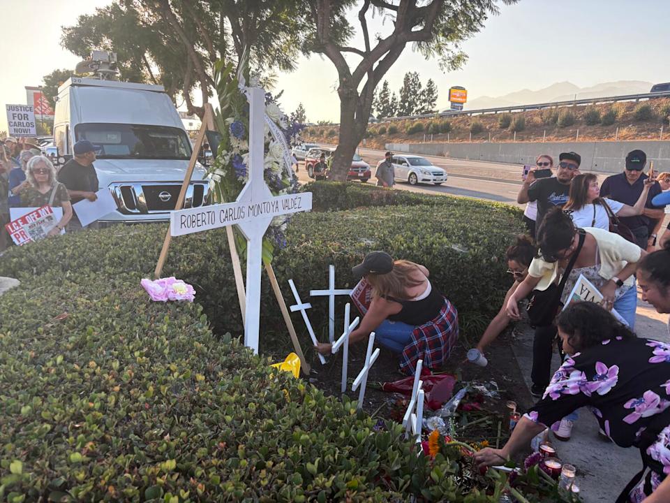 Vigil attendees laid flowers at a memorial outside a Home Depot in Monrovia Friday August.