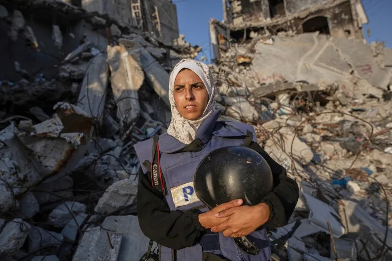 Freelance journalist Mariam Dagga, 33, who had been working with the Associated Press and other outlets during the Gaza war, poses for a portrait in Khan Younis, southern Gaza Strip, on June 14, 2024. Dagga was one of several journalists killed along with other people in Israeli strikes on Nasser Hospital in Khan Younis on Monday, Aug. 25, 2025. (AP Photo/Jehad Alshrafi)