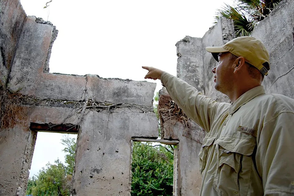 In this file photo, Matt Betz of the Archaeological and Historical Conservancy, points out cracks in the walls of Captain Horr's old house which is on the U.S. Register of Historic Places.
