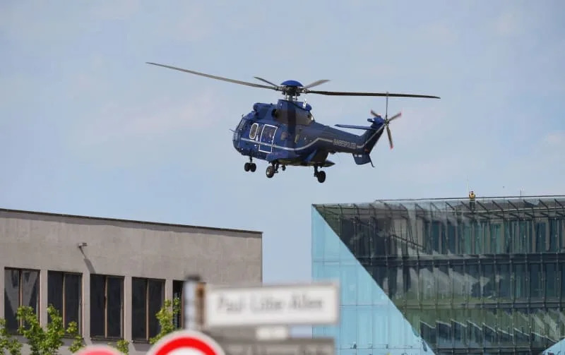 A German police helicopter lands in front of the Chancellery ahead of Ukrainian President Zelensky's participation in virtual consultations of European heads of state and government in view of the meeting between US President Trump and Russian President Putin. Sören Stache/dpa