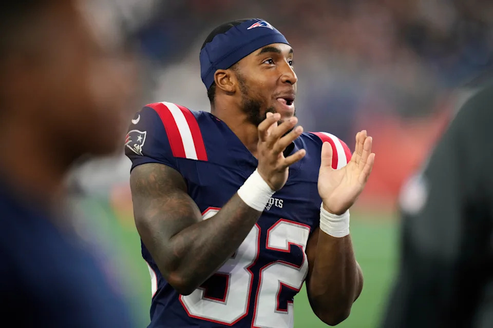 New England Patriots running back TreVeyon Henderson reacts after a touchdown during the second half of an NFL preseason football game against the Washington Commanders Friday, Aug. 8, 2025, in Foxborough, Mass. (AP Photo/Charles Krupa)