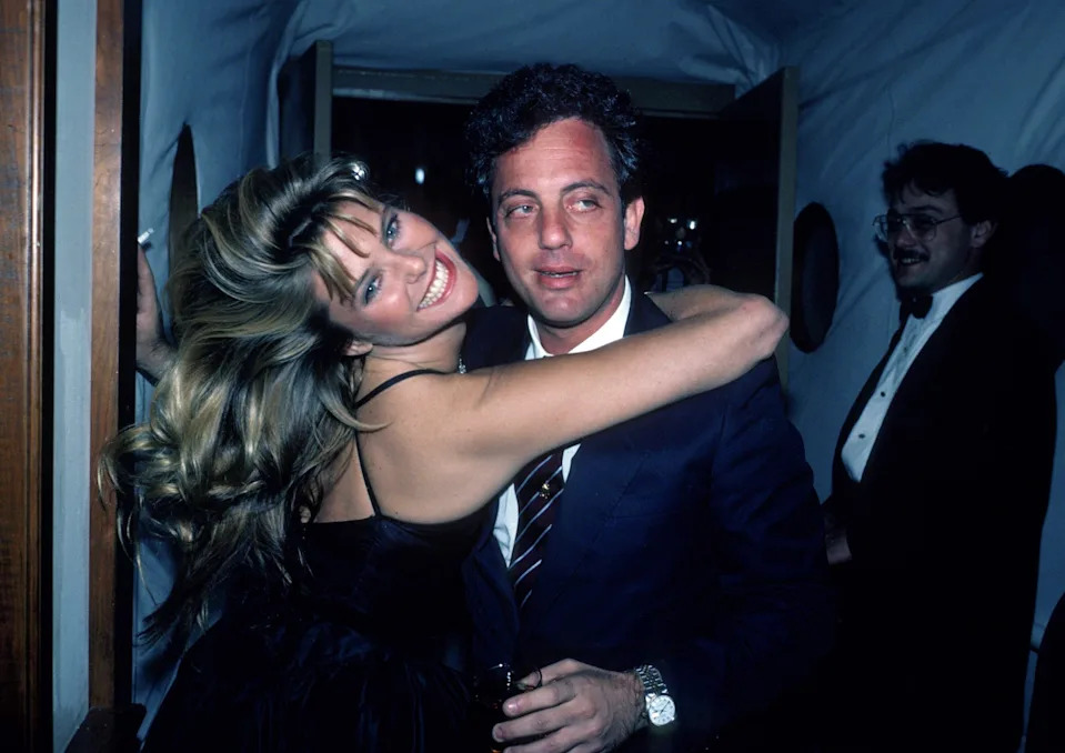 Christie Brinkley embracing Billy Joel in 1983