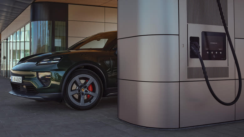 A Porsche EV charging at an EV charger.