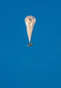  A high-altitude balloon rises from the Malemute Drop Zone during exercise ARCTIC EDGE 2025 (AE25) at Joint Base Elmendorf-Richardson, Alaska, Aug. 4, 2025. The launch was conducted to test the use of hydrogen in high-altitude balloons. AE25 is a North American Aerospace Defense Command and U.S. Northern Command-led homeland defense exercise designed to improve readiness, demonstrate capabilities, and enhance Joint and Allied Force interoperability in the Arctic. (U.S. Air Force photo by Staff Sgt. Jonathan McElderry)