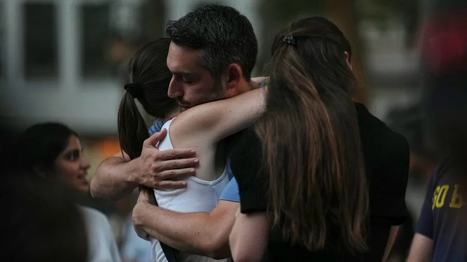 Community members gathered in New York City to honor the victims of the shooting Tuesday evening. - Angelina Katsanis/AP
