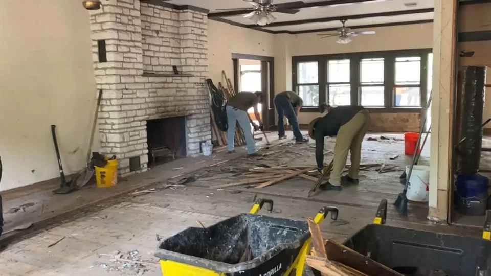 Volunteers remove moldy parts of Betty Matteson’s flood-damaged home. - Courtesy Shannon Swindle
