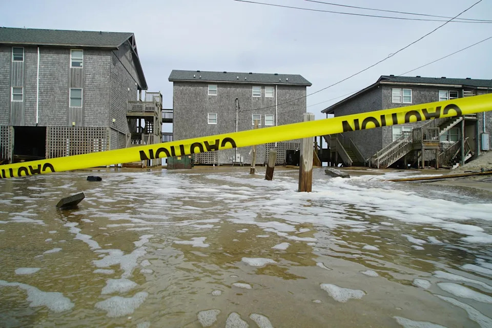 Sea water pushed inland by Hurricane Erin surges under the Cape Hatteras Motel in Buxton, North Carolina. NASA wants Americans to help document damage from tropical storms (AP)