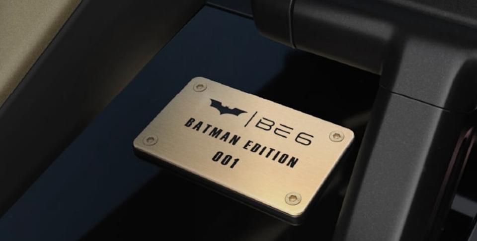 The dashboard features a numbered gold plaque.