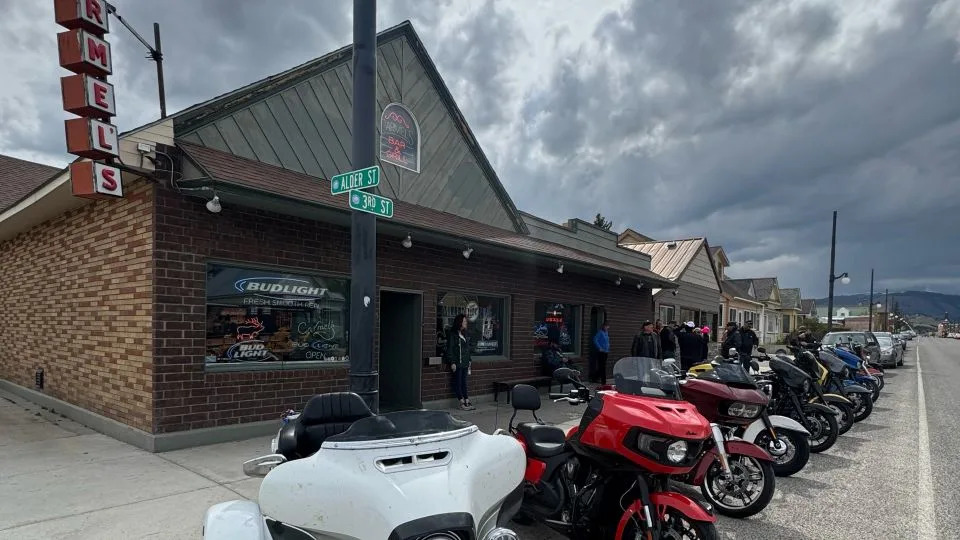 The owners of Carmel's Bar & Grill in Anaconda have decided to keep doors locked around the clock while a killer is on the loose. Customers must call or knock on the door to be screened before entering. - Tamara Charles