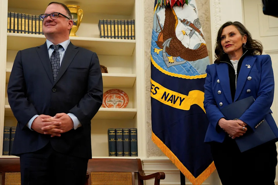Michigan Governor Gretchen Whitmer stands next to Michigan House Speaker Matt Hall, as President Donald Trump (not pictured) signs executive orders and proclamations, in the Oval Office at the White House in Washington, D.C. on April 9, 2025.