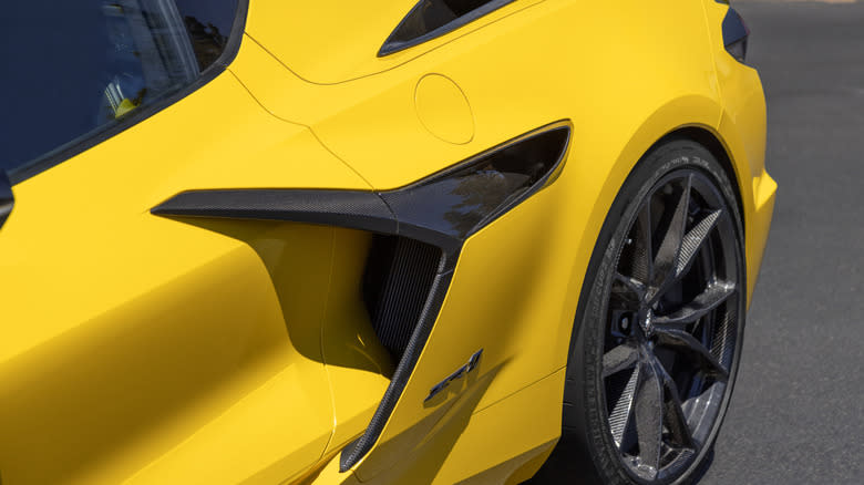 a close-up of a yellow Corvette ZR1's left side air intake