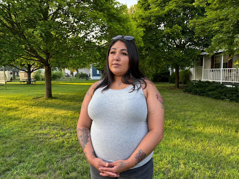 Julia Martell recounts seeing a man running with a knife at a Walmart in Traverse City, Mich. A man is accused of stabbing 11 people in the store on July 26, 2025. (Selina Guevara / NBC News)