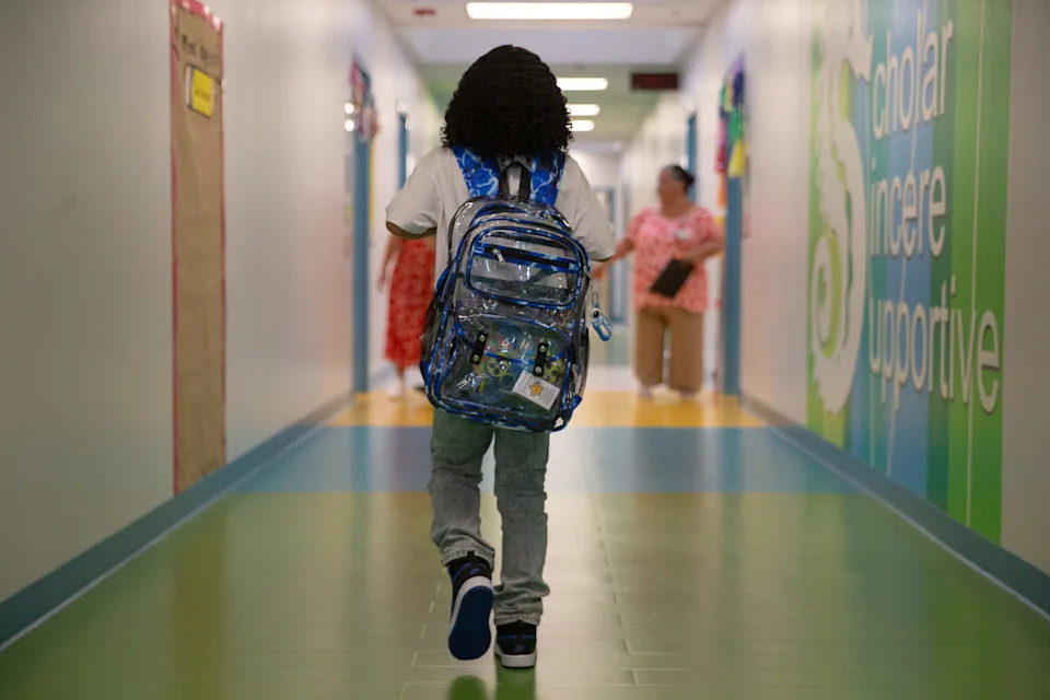 A student walks through a hallway at Calk-Wilson Elementary School in Corpus Christi on Aug. 11.