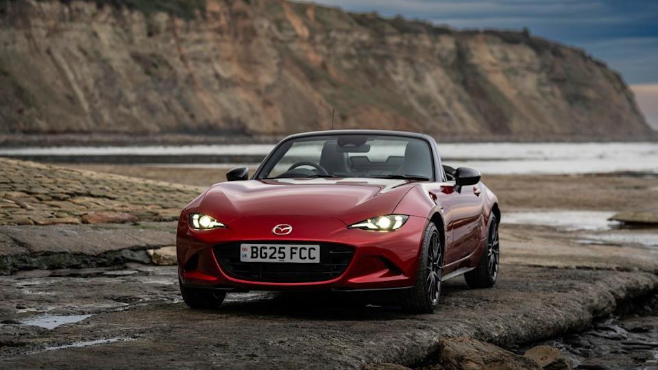 Red 2024 Mazda MX-5 Miata Parked With Roof Down Front 3/4 View