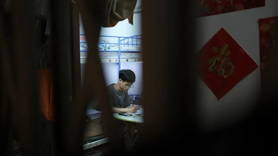 Roy, a 15 year old resident of a subdivided flat that he shares with his mother  in Sham Shui Po, Hong Kong, on July 4, 2025. - Catherine Phillips/CNN