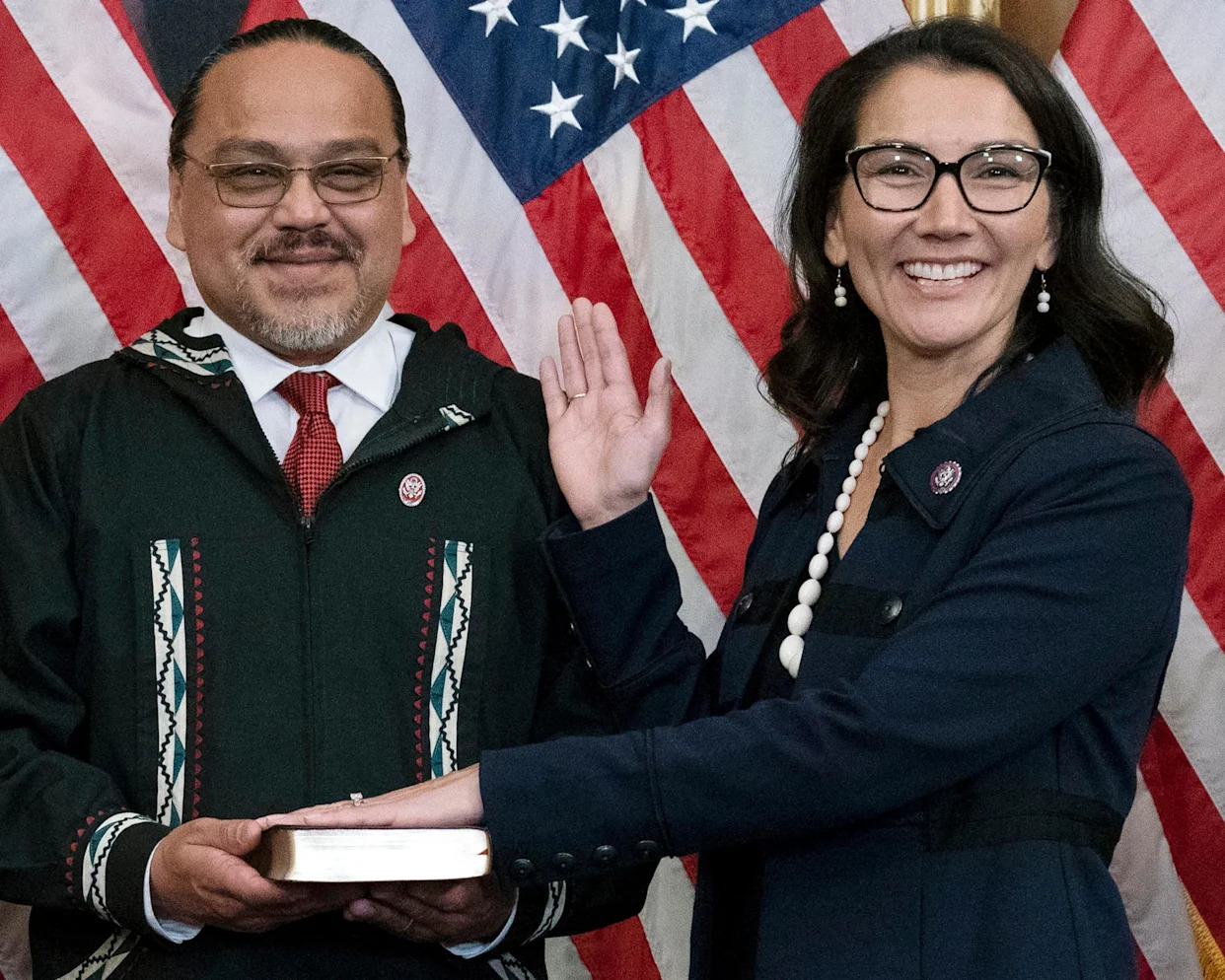 <span>Eugene ‘Buzzy’ Peltola Jr holds the Bible during a ceremonial swearing-in for his wife, Alaska congresswoman Mary Peltola, on Capitol Hill in Washington DC on 13 September 2022.</span><span>Photograph: José Luis Magaña/AP</span>