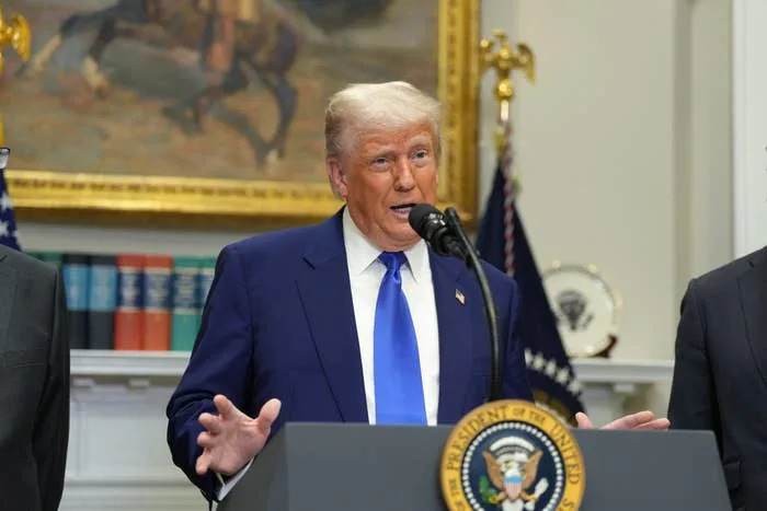 Donald Trump speaks during a news conference in the Roosevelt Room of the White House
