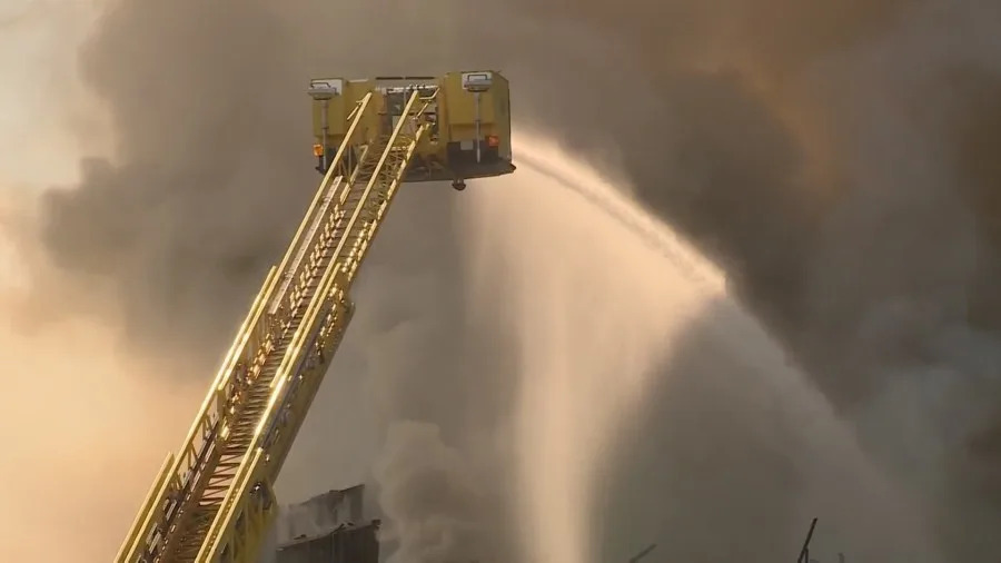 Clark County fire crews battle a large blaze at a business complex across the street from the UNLV campus on Maryland Parkway, near Tropicana Avenue on July 25, 2025. (KLAS)