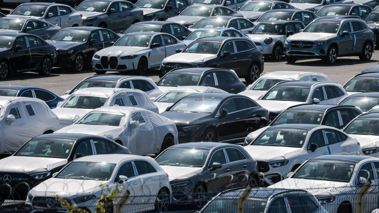Cars of german car makers Mercedes and BMW stand parked at the automotive terminal on August 11, 2025 in Bremerhaven, Germany. Following an agreement between the European Union and the administration of U.S. President Donald Trump, a tariff of 15% on most imports from the EU to the US, including automobiles and parts, went into effect on August 7. Some items face no tariffs, while steel and aluminum are tagged with a 50% tariff.