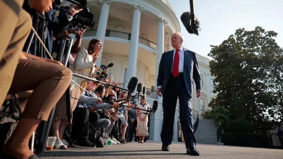 President Donald Trump talks to reporters as he departs the White House on July 25, 2025, in Washington, DC. - Chip Somodevilla/Getty Images