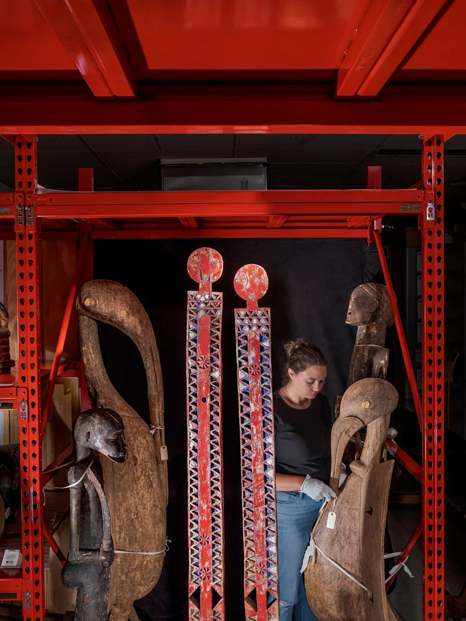 View of two tall wooden posts called vigango at the Illinois State Museum.