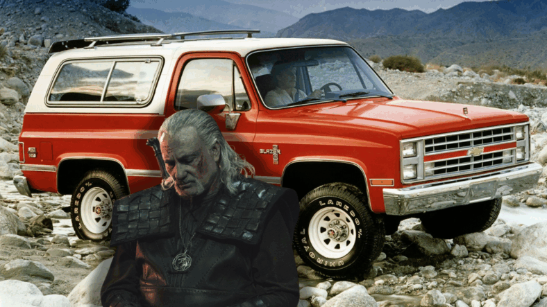 Vesemir standing next to a K5 Blazer