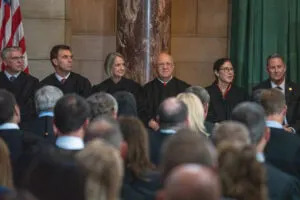 Nebraska Supreme Court justices at the 2024 investiture of Chief Justice Jeffrey Funke, far right. The justices sat by seniority, right to left, with Lindsey Miller-Lerman next to Funke. (Zach Wendling/Nebraska Examiner)