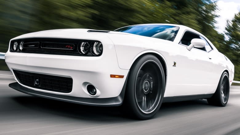 A white Dodge Charger on a highway