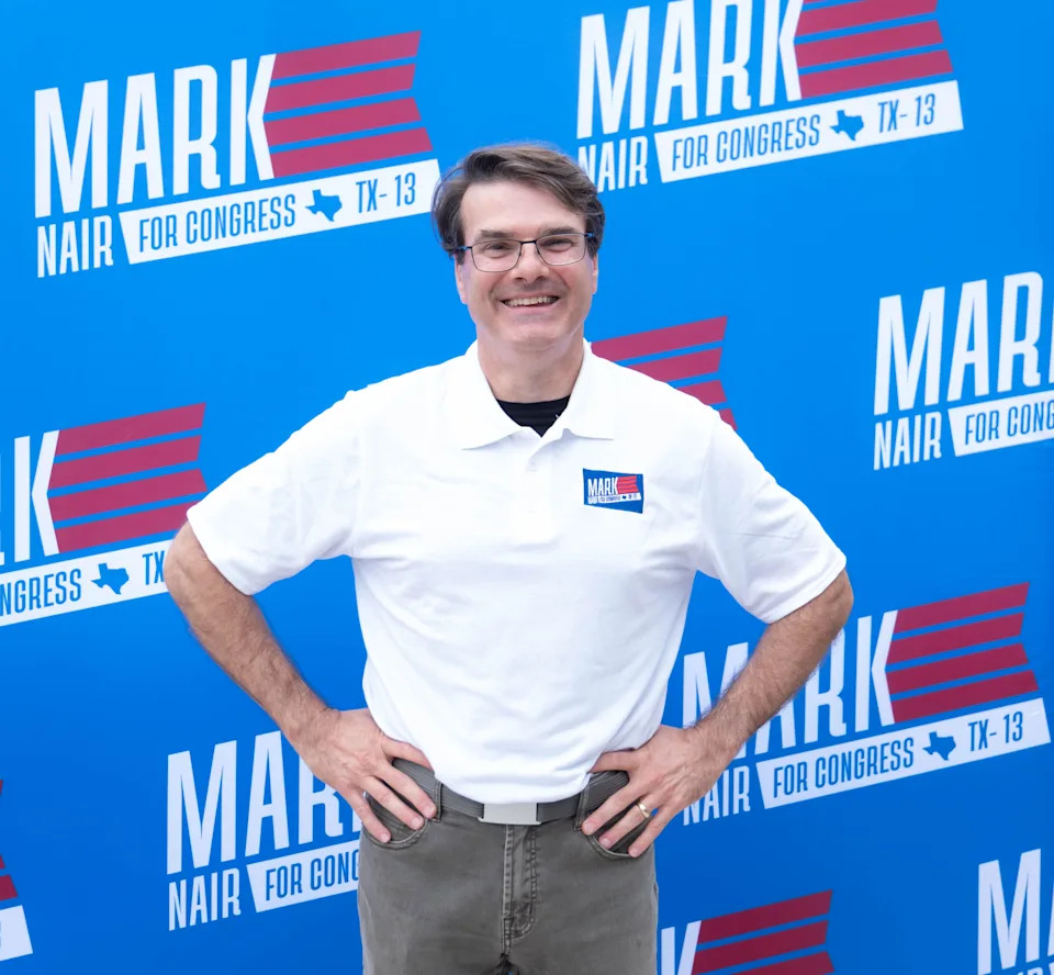 Mark Nair poses in front of his campaign banner after announcing his run for Congress in Texas’ 13th District during a launch event at Crush Wine Bar and Grill in downtown Amarillo on Aug. 26, 2025.