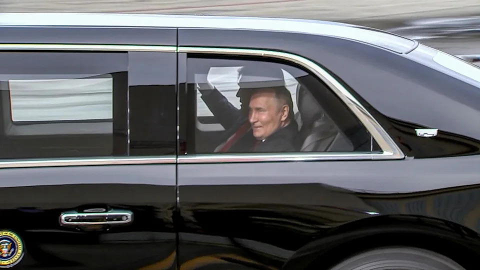 Putin gets warm welcome from Trump at Alaska summit, including a ride in 'The Beast'