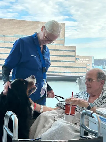 Bernese Mountain dog Fini visits Christopher Kennedy in the hospital. / Credit: Christopher Kennedy / Cleveland Clinic