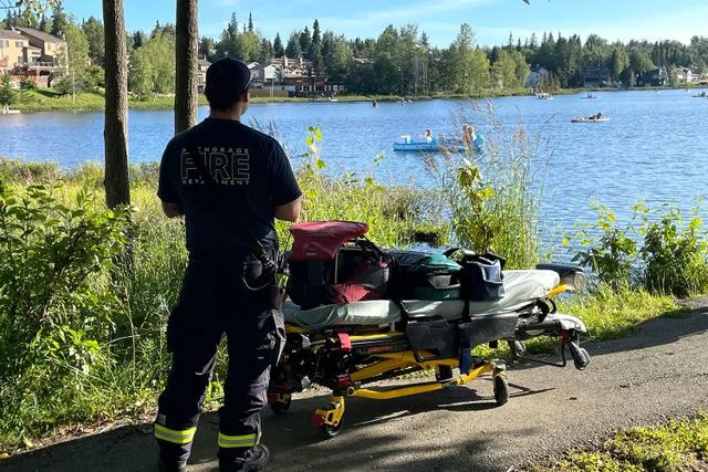 The Anchorage Fire Department/Facebook A firefighter watches the search for a missing paddle boarder