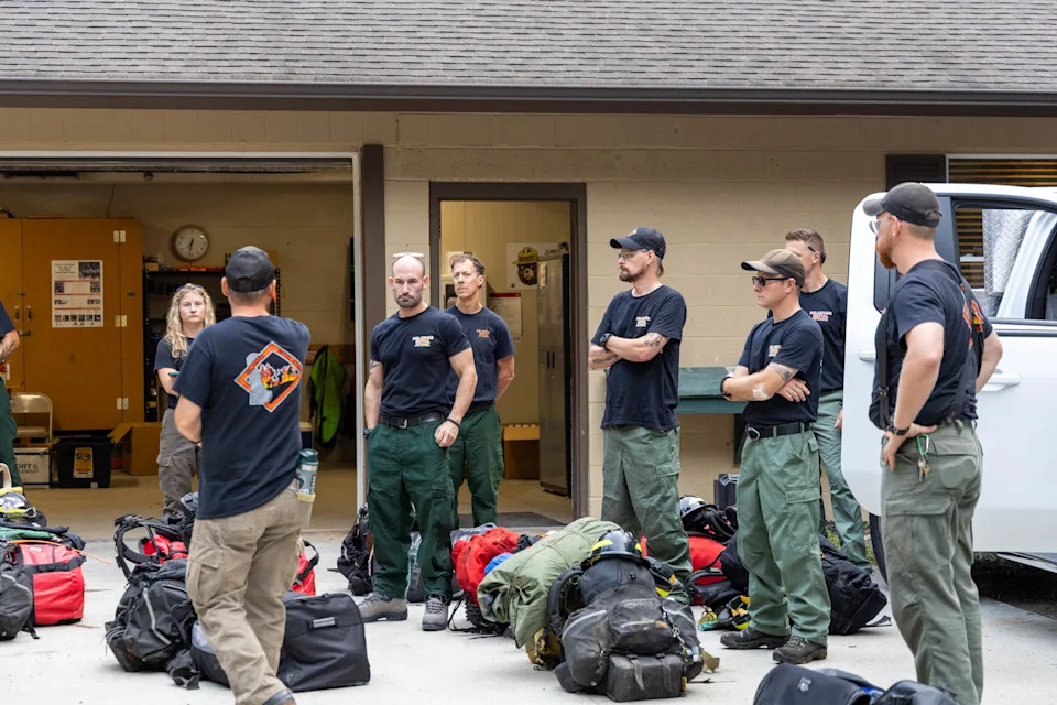 Before leaving to help battle a fire in Arizona, the members of the Delaware wildland firefighting crew gather their gear at Blackbird State Forest near Smyrna on Aug. 13, 2025.
