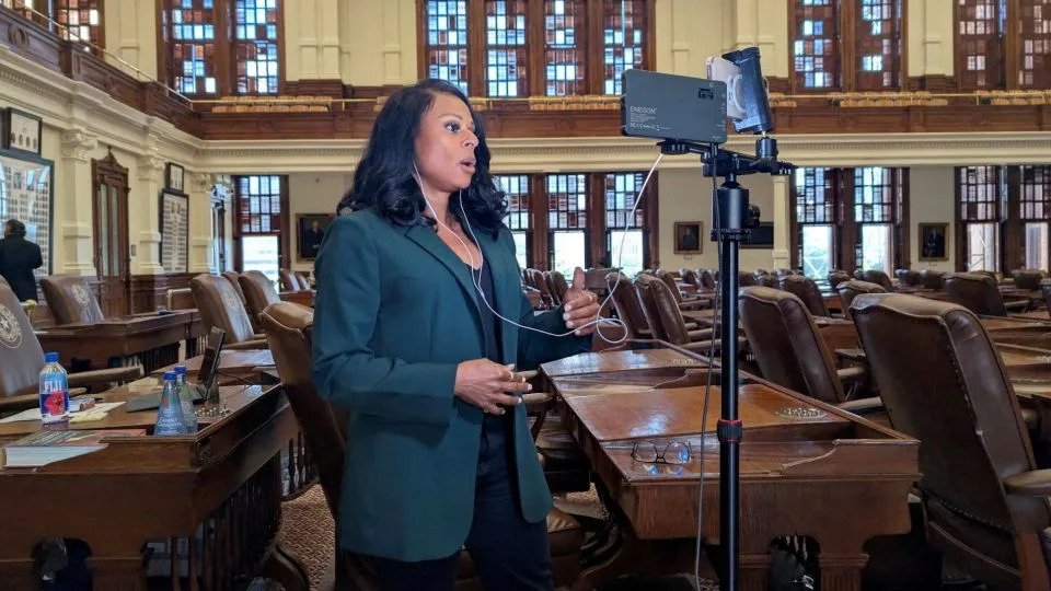 State Rep. Nicole Collier talks on the phone from the floor of the House, where she has chosen to remain until Wednesday, after Democratic lawmakers who had left the state to prevent Republicans from redrawing Texas’s 38 congressional districts returned to the Capitol in Austin, Texas, on August 18, 2025. - Gene Wu/Handout/Reuters