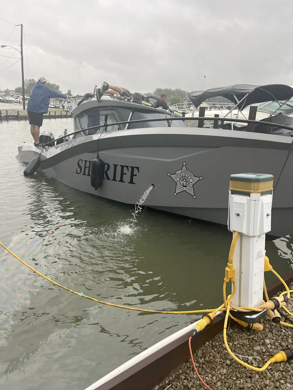 Maintenance men used pumps to get the Ottawa County Sheriff's Office's newest patrol boat back floating within two hours after it took on water and sank Thursday morning. This photo was taken at 9:48 a.m. July 31, 2025.