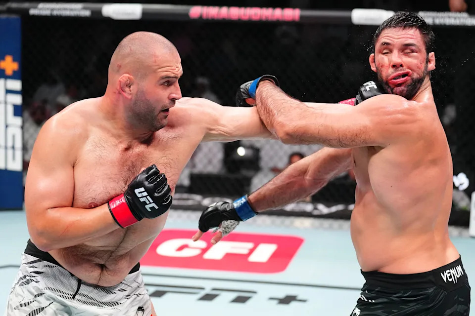 ABU DHABI, UNITED ARAB EMIRATES - JULY 26: (L-R) Martin Buday of Slovakia punches Marcus Buchecha of Brazil in a heavyweight fight during the UFC Fight Night event at Etihad Arena on July 26, 2025 in Abu Dhabi, United Arab Emirates. (Photo by Chris Unger/Zuffa LLC)