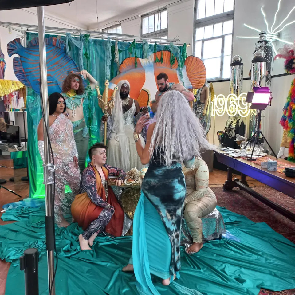 Sérah Jophiel Munroe works behind the scenes, giving instruction, at the Trans Tapestry Portrait Project's Cleveland photo shoot.