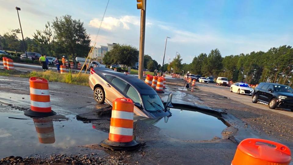 That Sinking Feeling: Car At Stoplight Falls Into Sinkhole